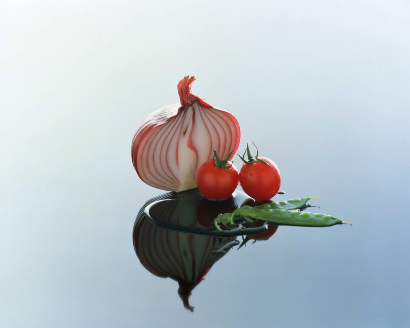 Fresh vegetables on reflective surface