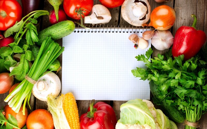 Fresh vegetables with notebook