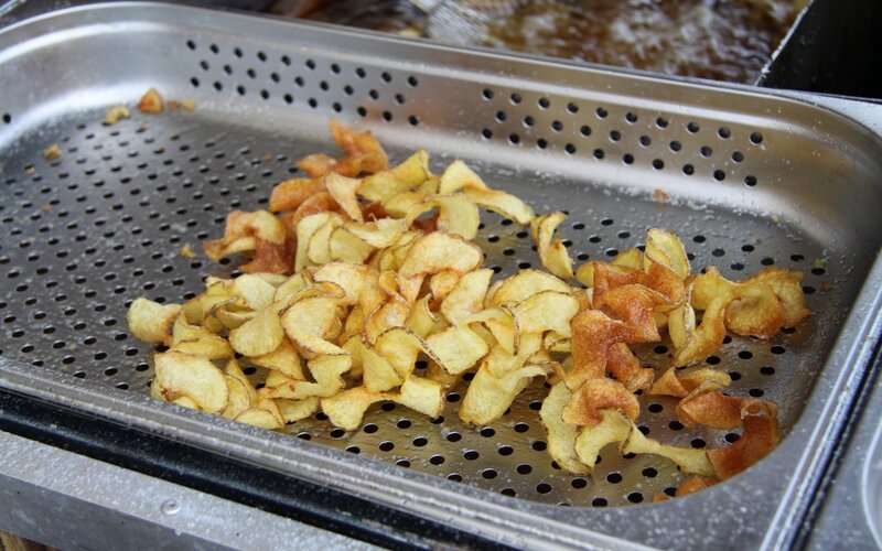 Freshly fried potato chips