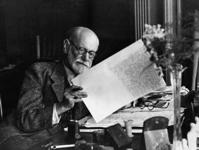 Freud reading manuscript