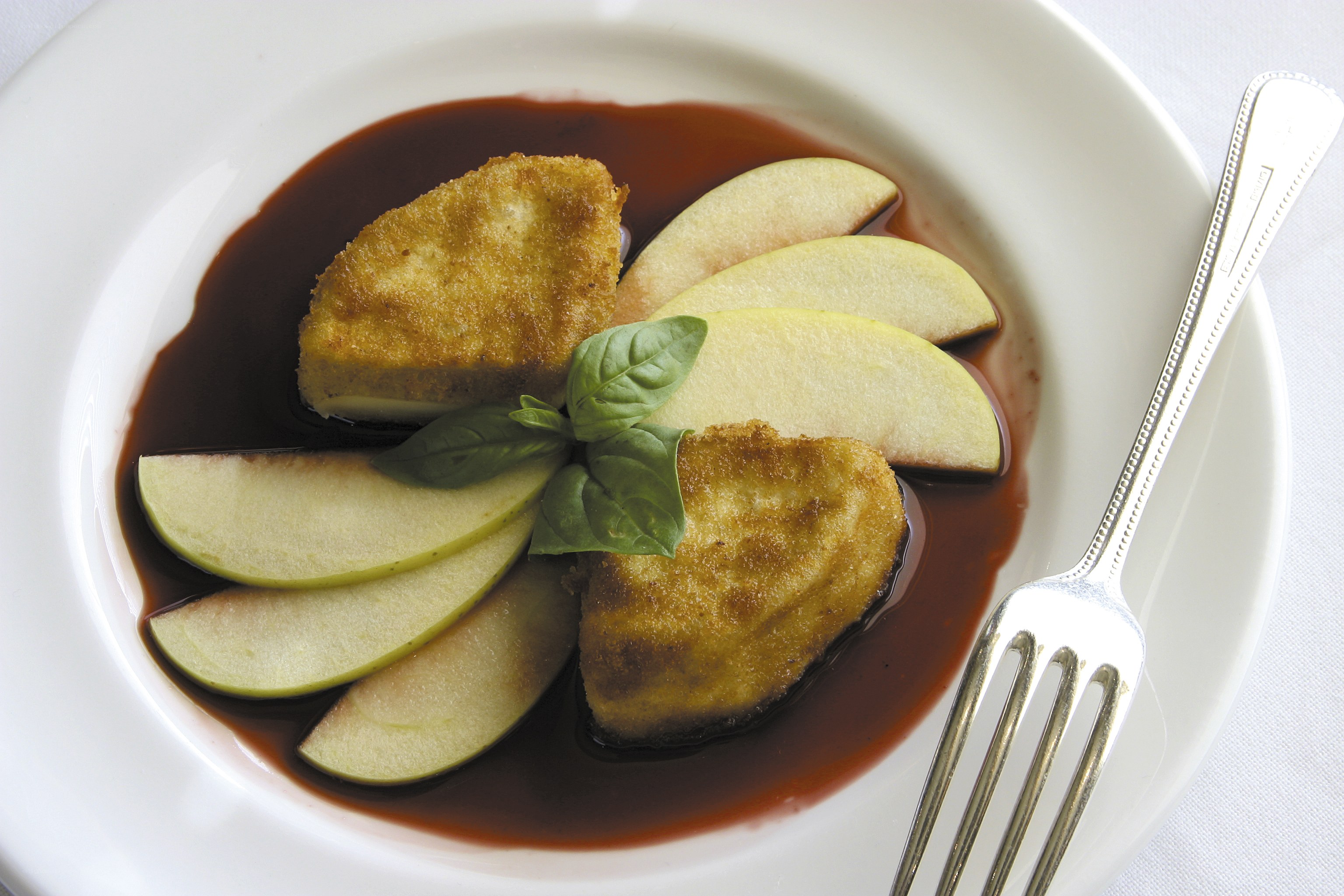 Fried cheese with apple and sauce