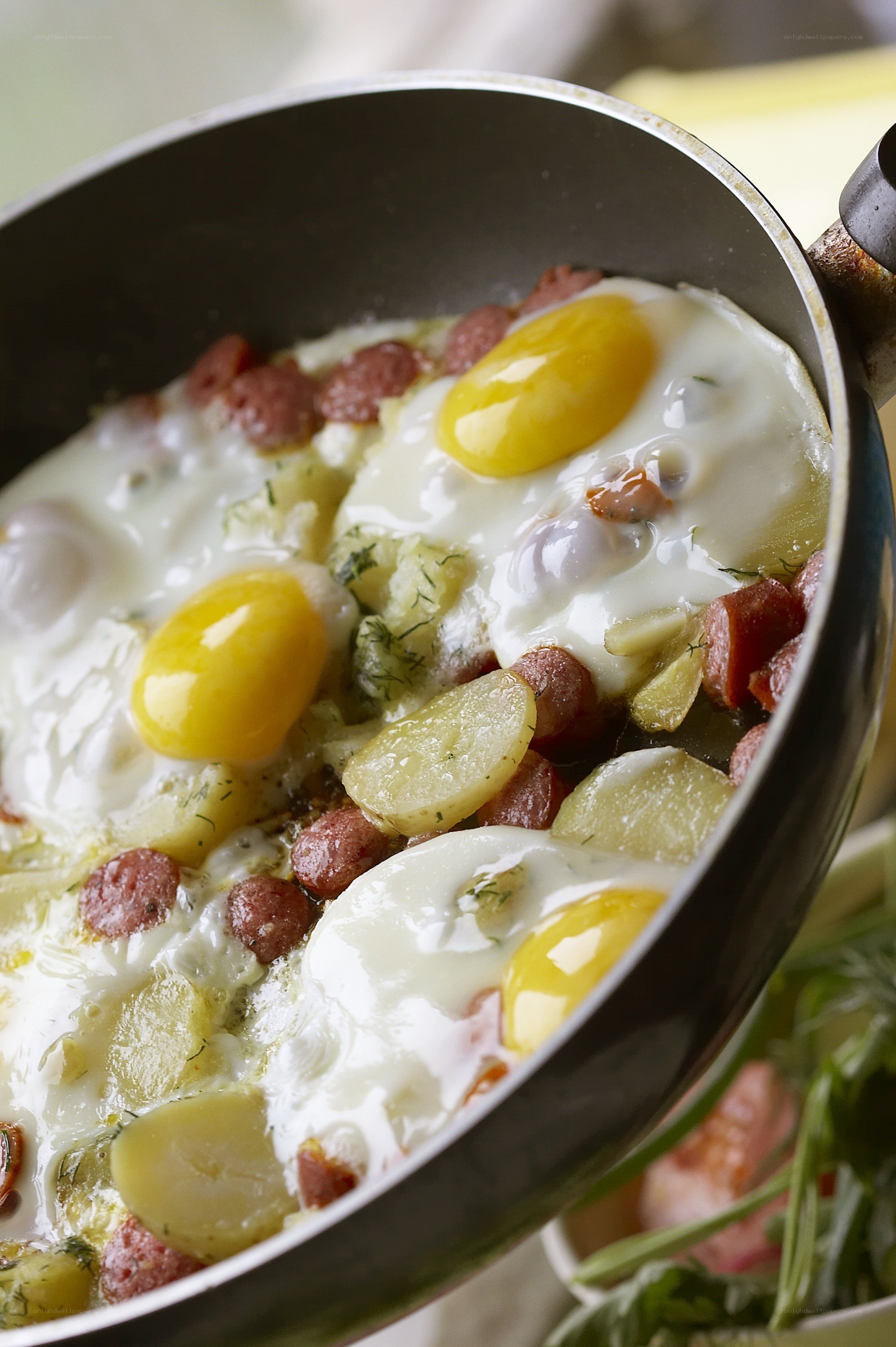 Fried eggs with sausage and potatoes