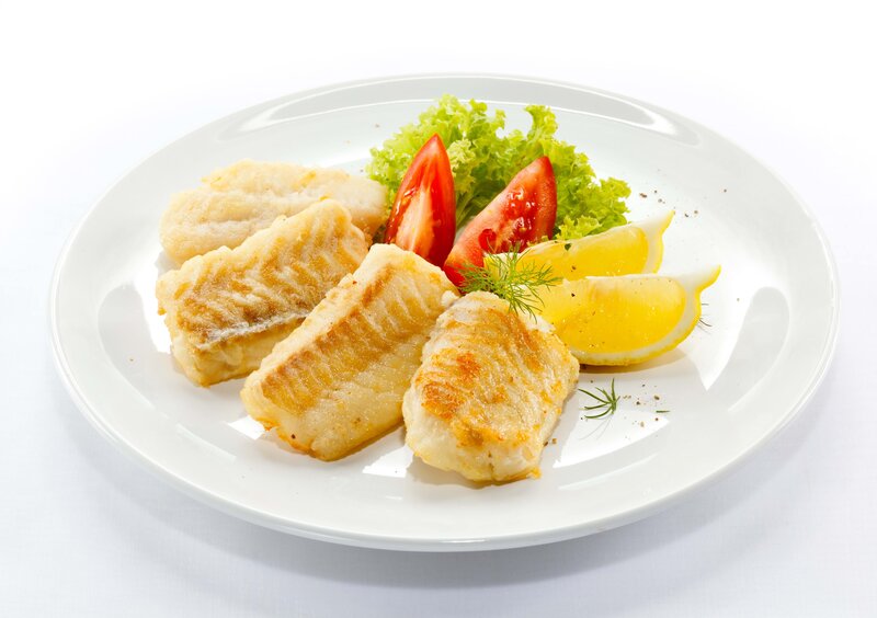 Fried fish fillets with salad