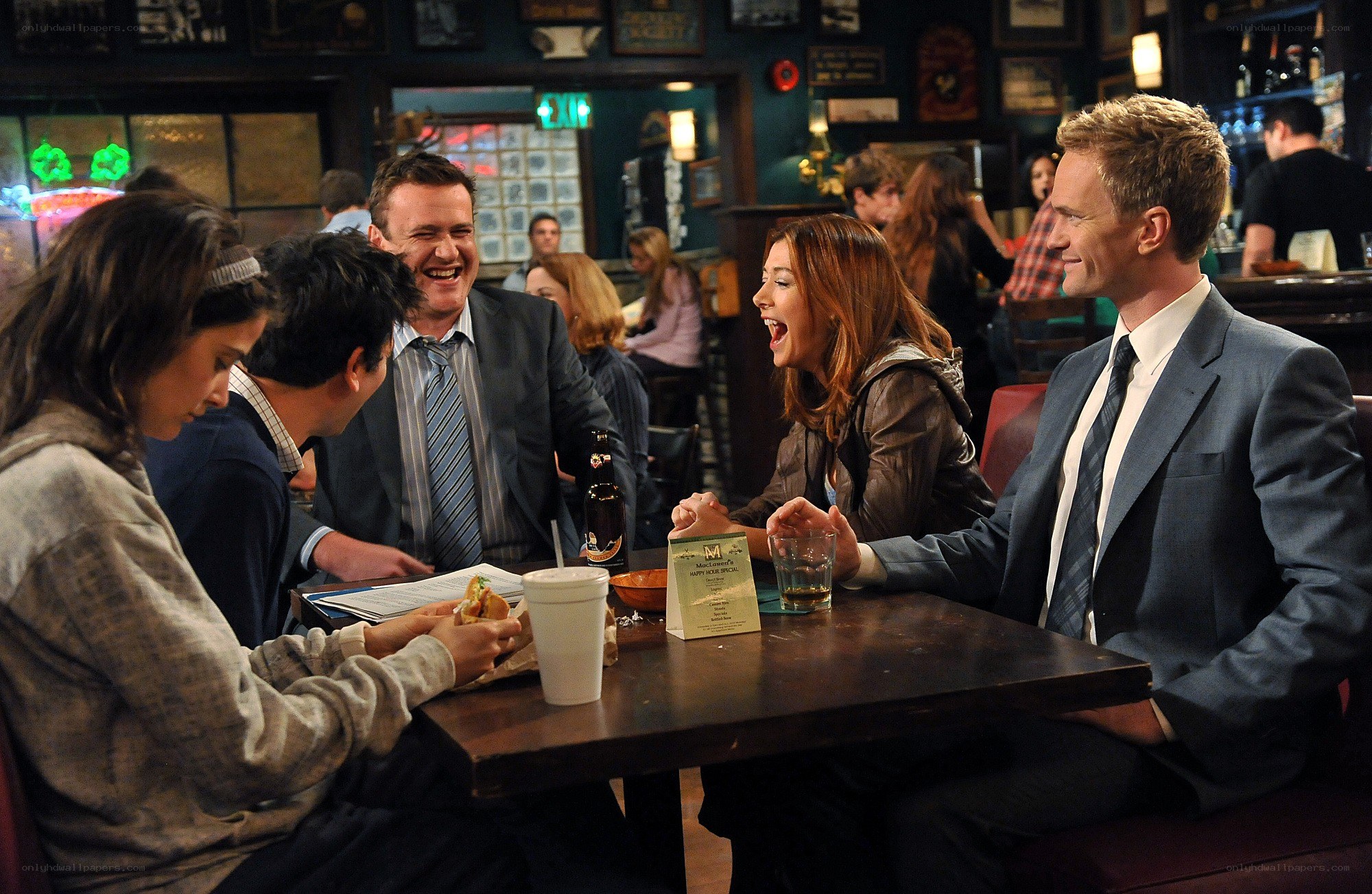 Friends at a bar laughing
