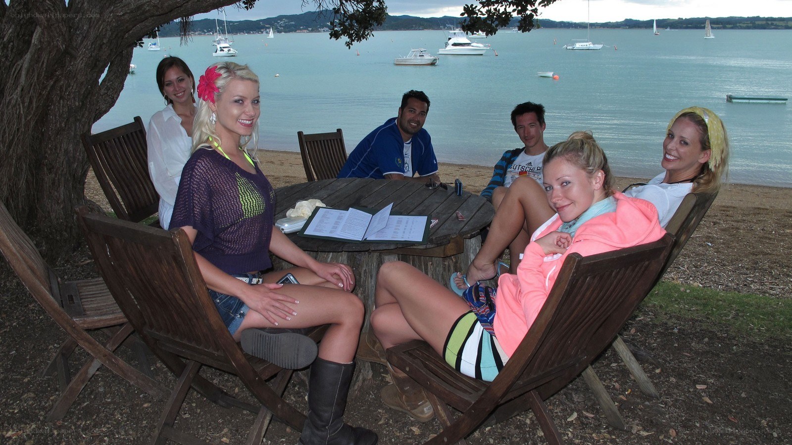 Friends at a waterfront table
