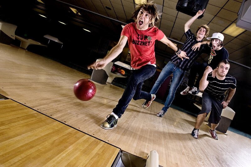 Friends bowling with energy