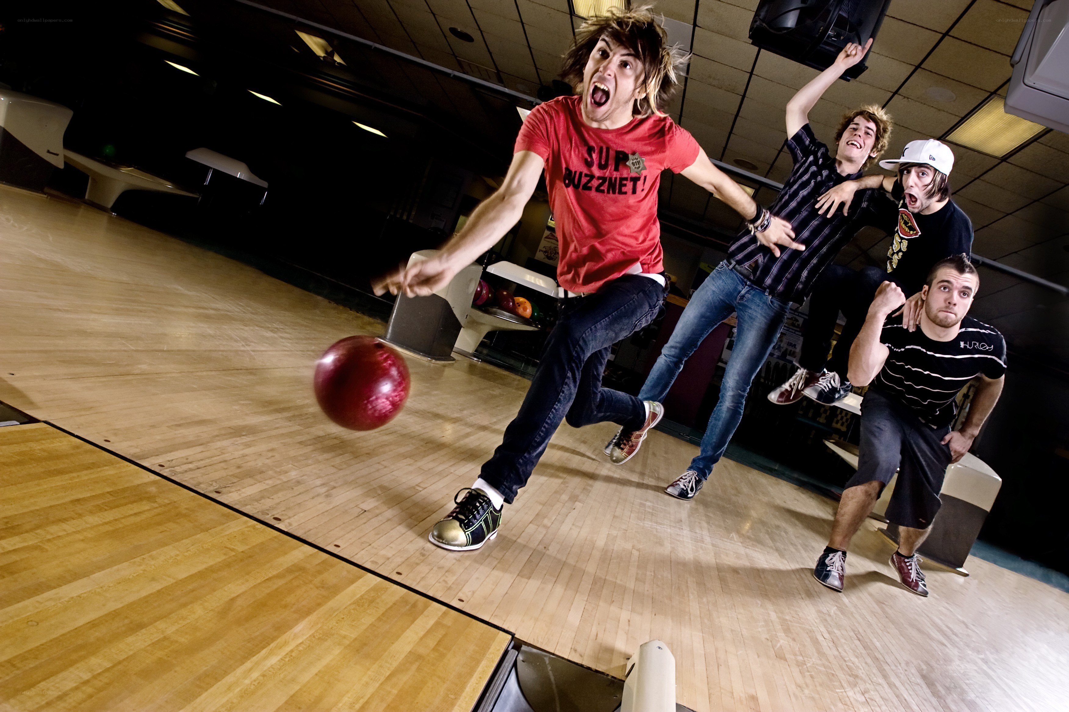 Friends bowling with energy