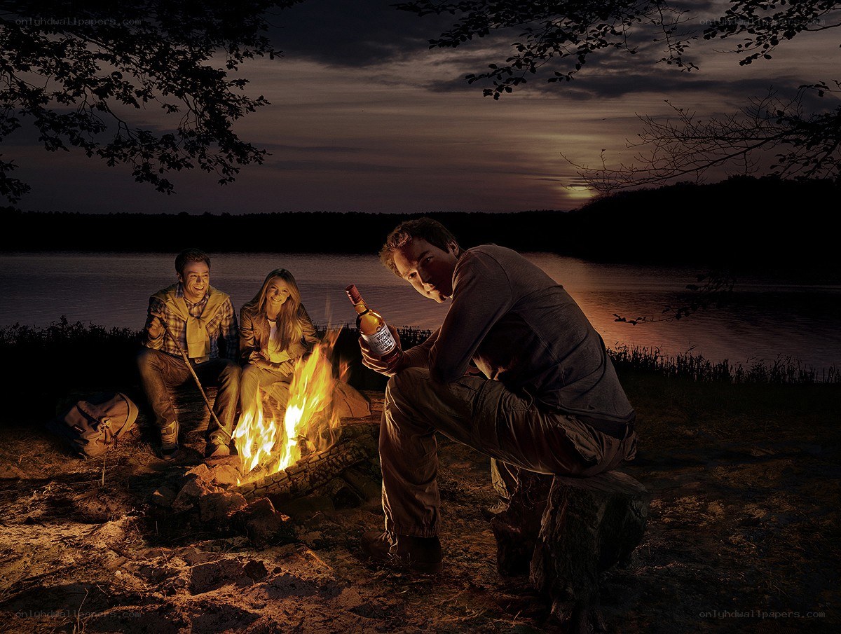 Friends by a campfire at dusk