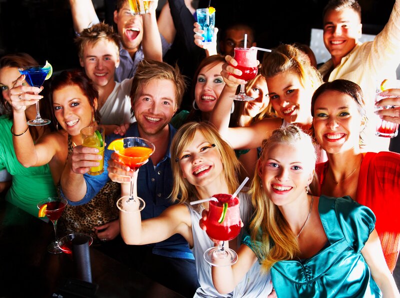 Friends celebrating with cocktails