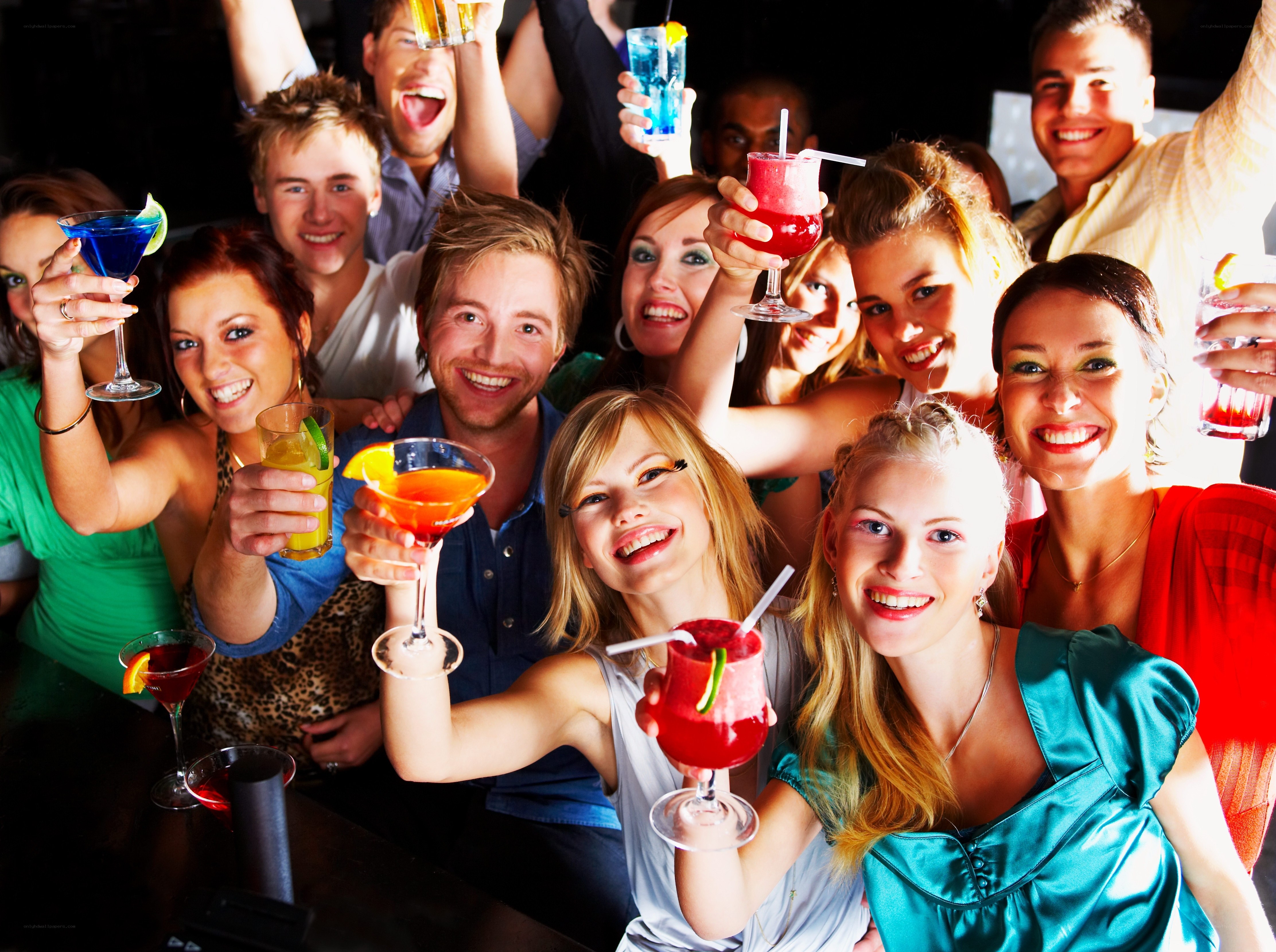 Friends celebrating with cocktails