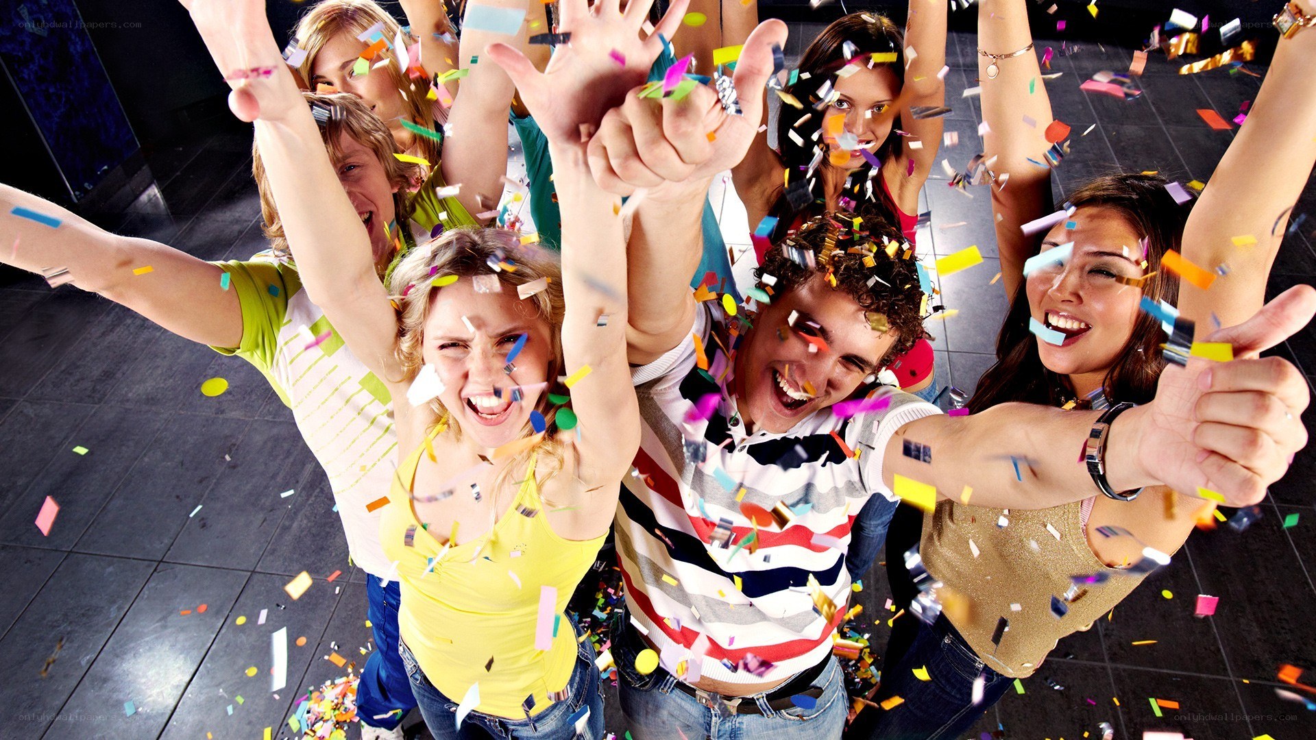 Friends celebrating with confetti