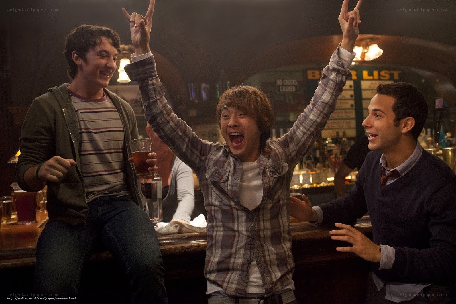 Friends cheering at a bar
