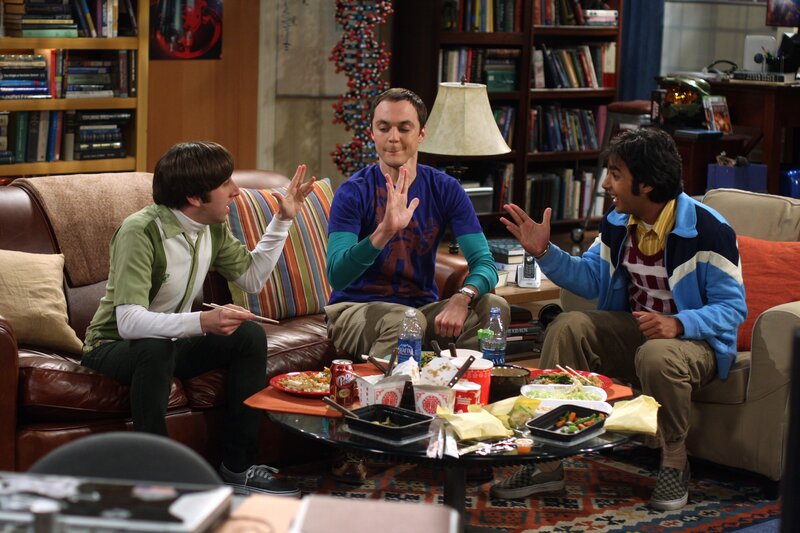 Friends eating takeout on couch