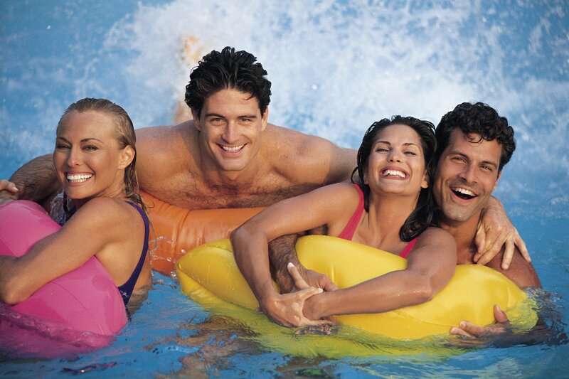Friends enjoying pool floaties