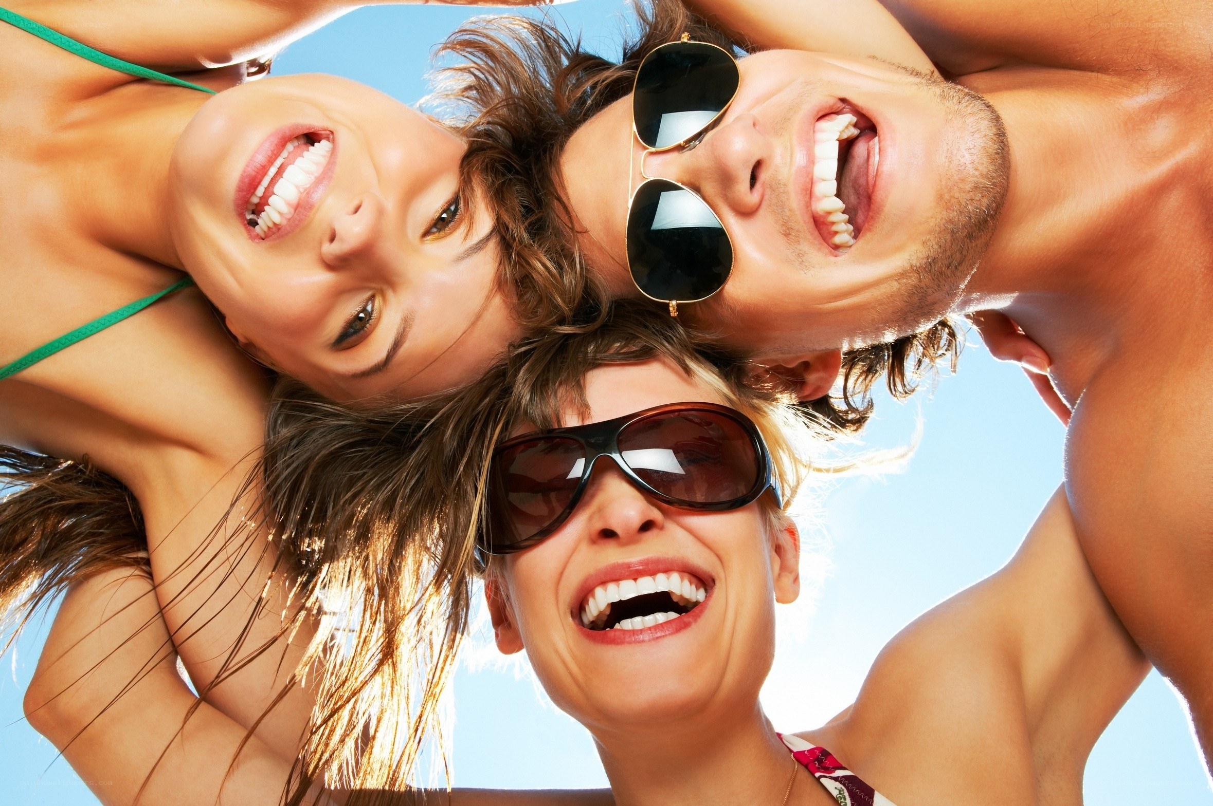 Friends laughing at the beach