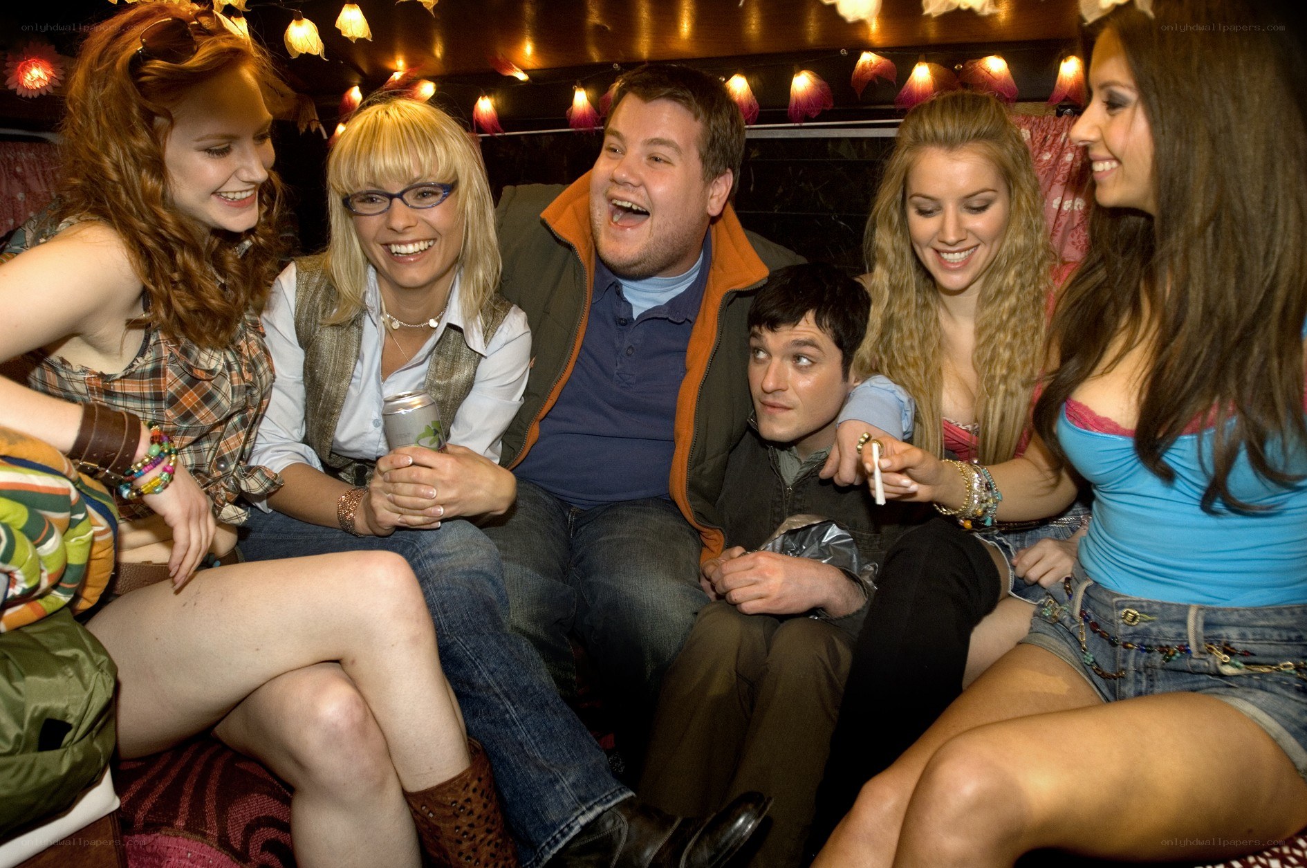 Friends laughing in a party bus