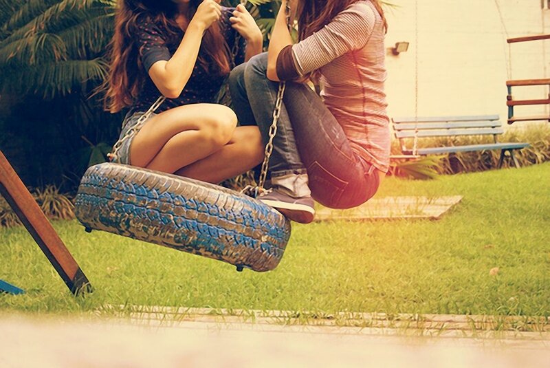 Friends on a tire swing