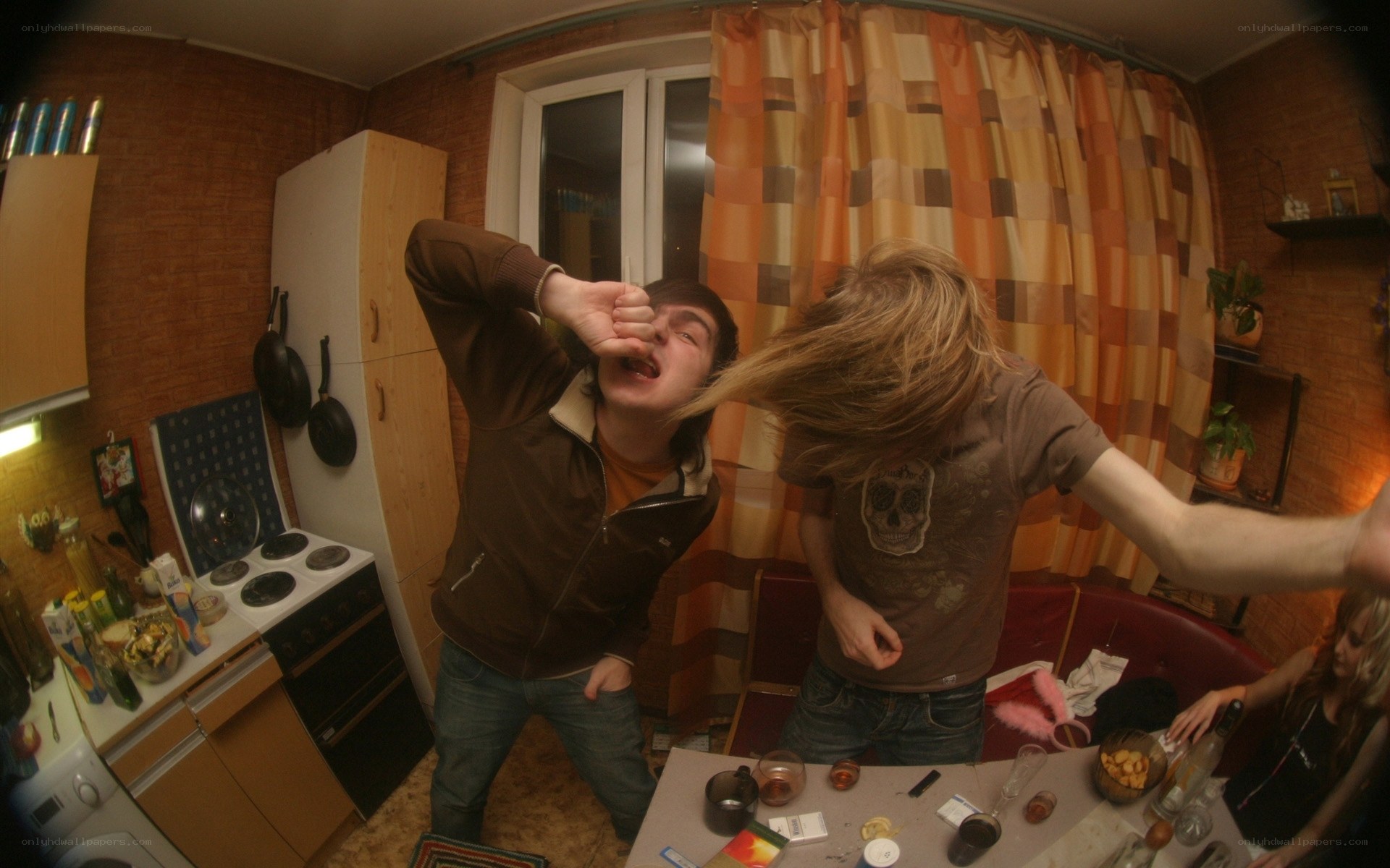 Friends partying in kitchen