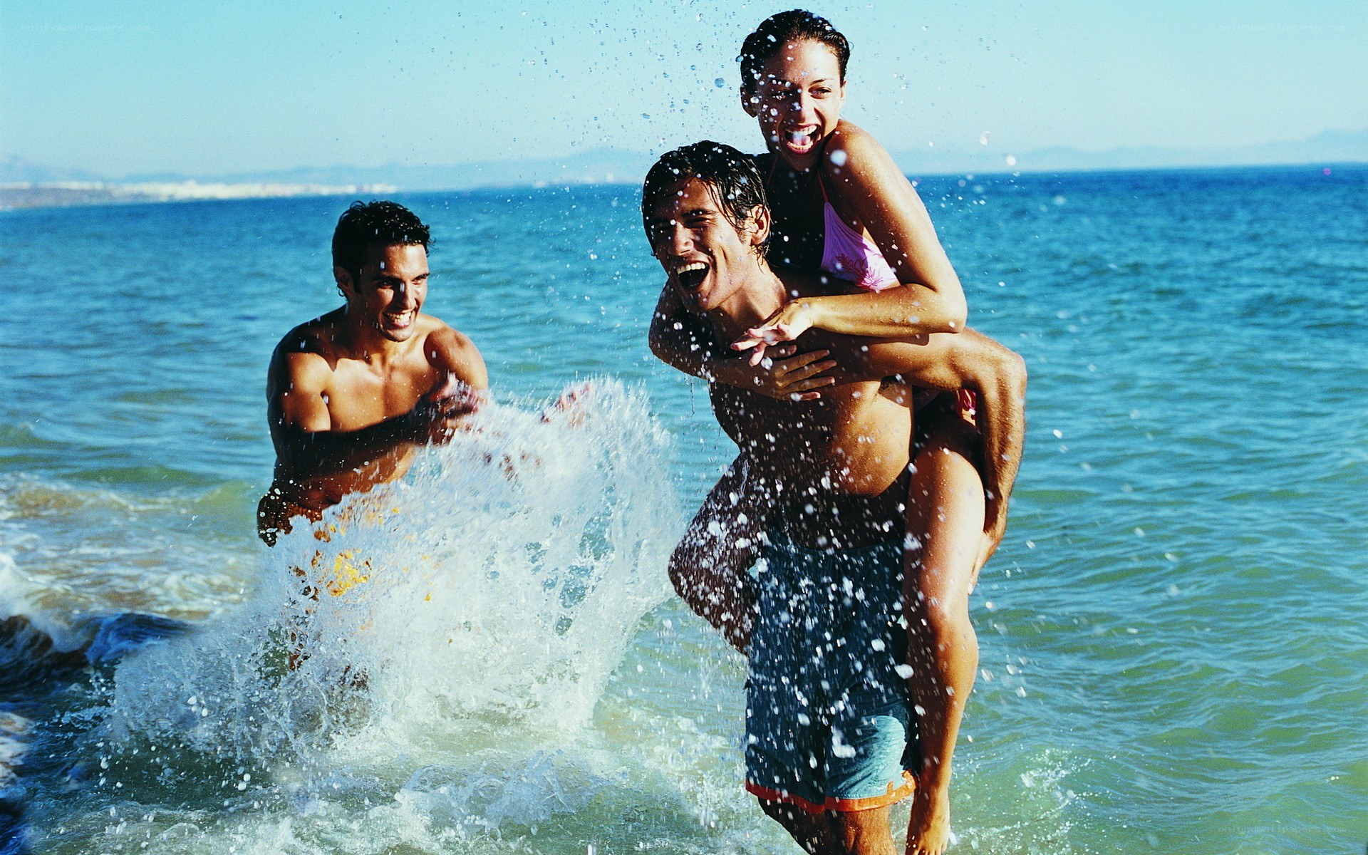 Friends playing in the ocean
