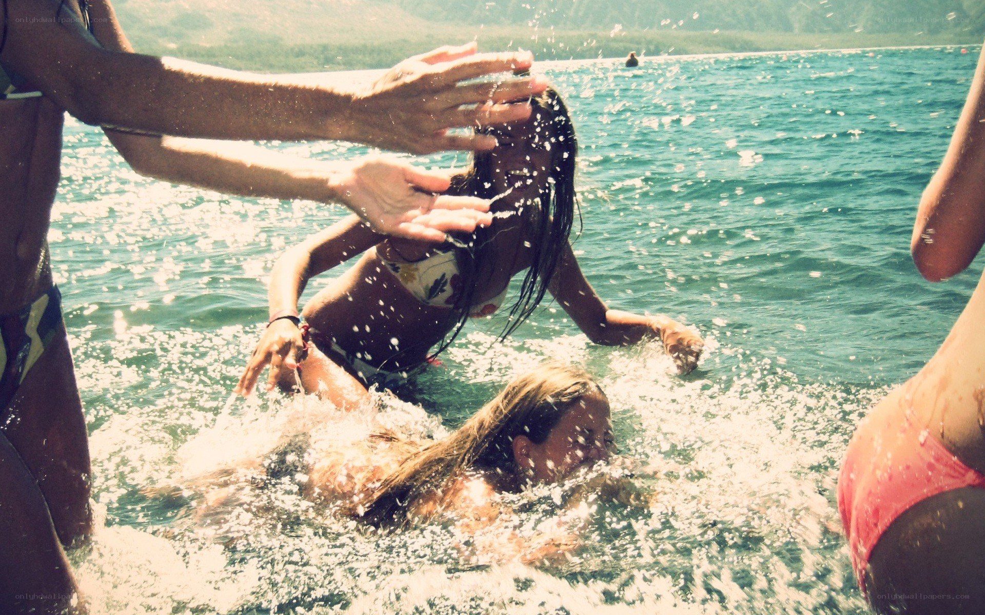 Friends playing in the ocean