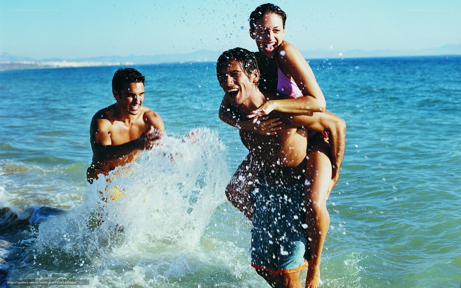 Friends playing in the ocean