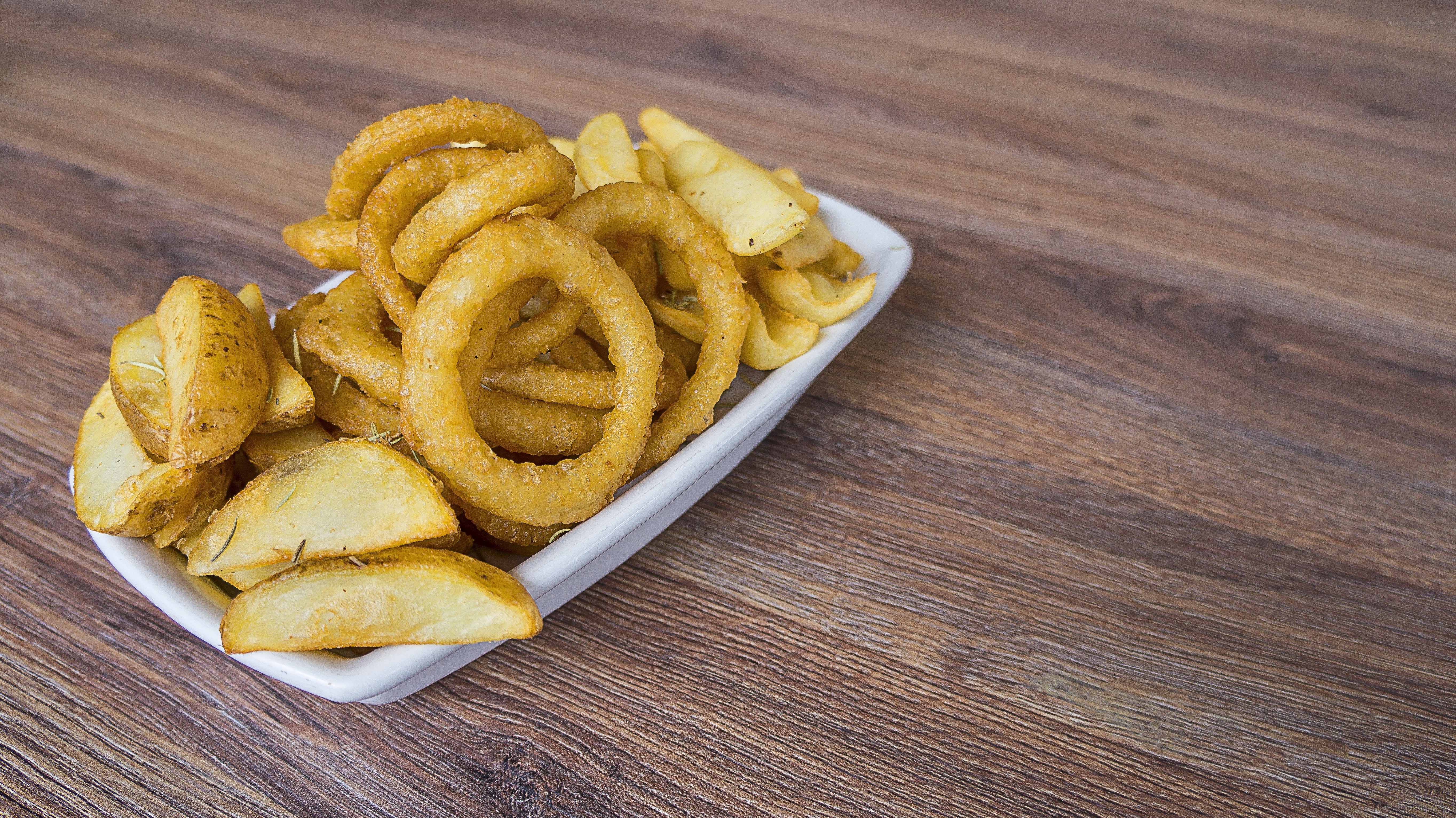 fries and onion rings on table