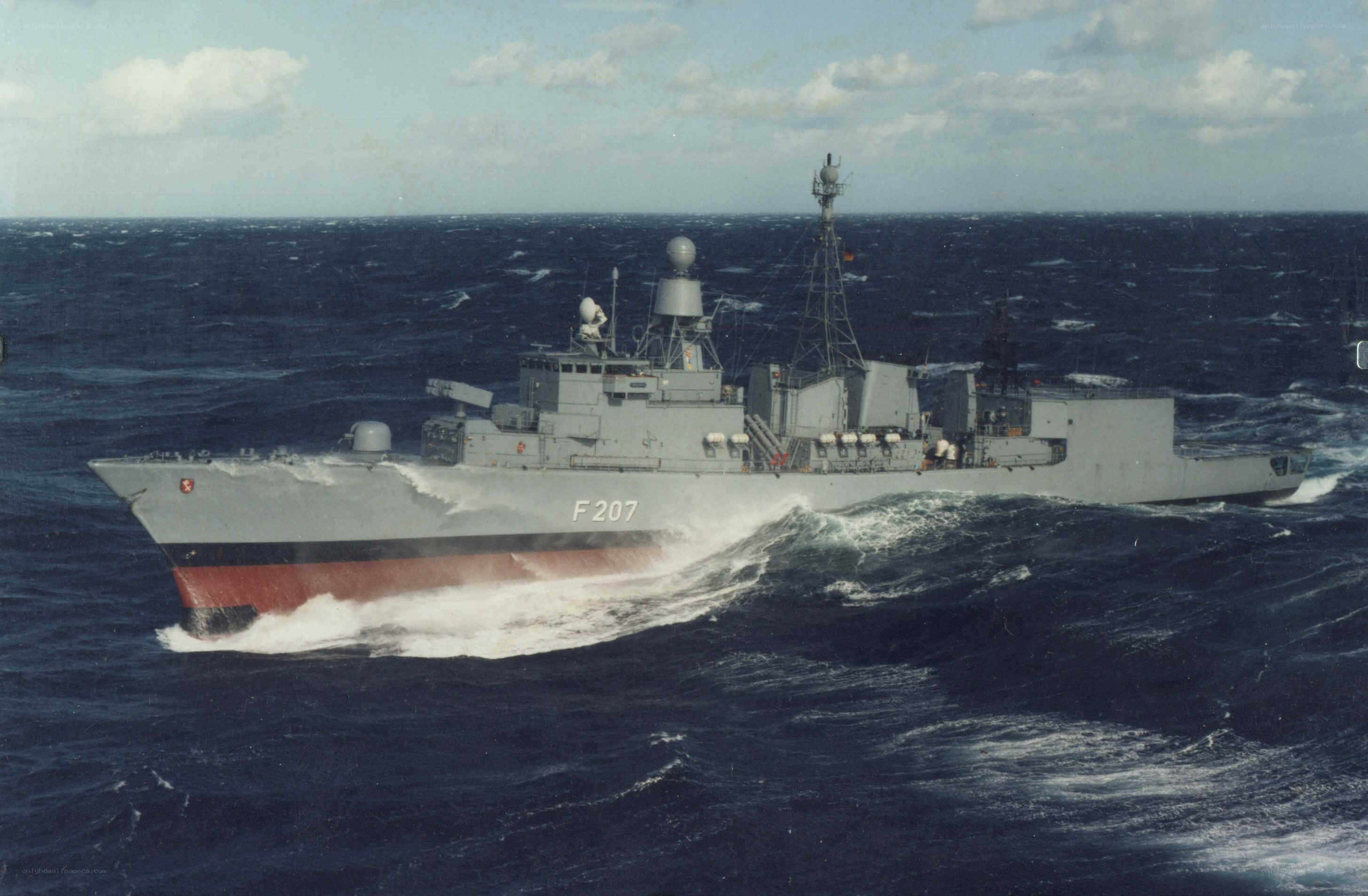 Frigate at sea in rough waters