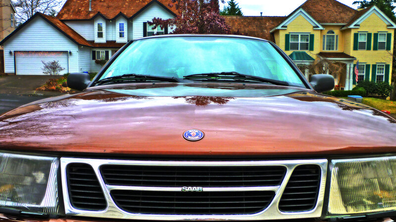 Front of a Saab car in a neighborhood