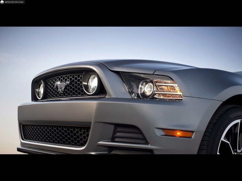 front of a silver mustang