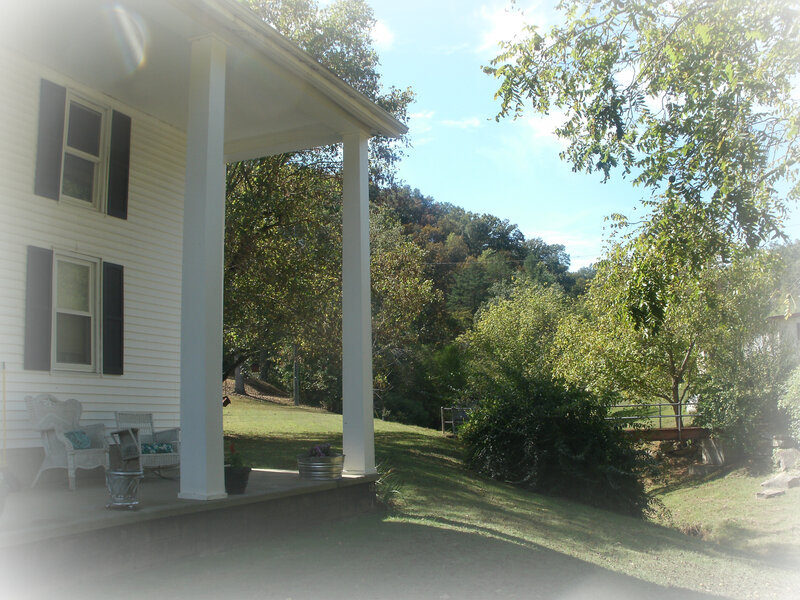 Front porch with white wicker furniture