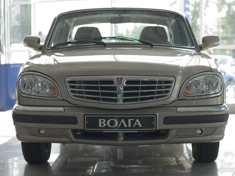 Front view of a beige Volga car