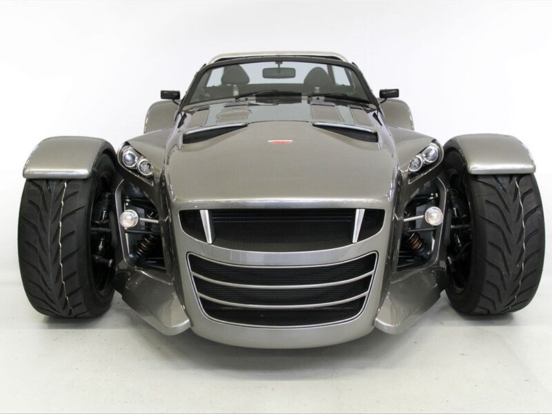 front view of a silver three-wheeled car