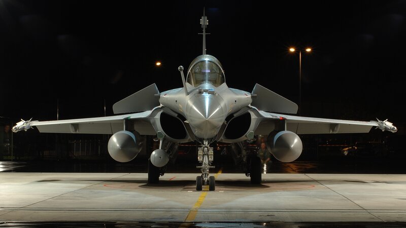 Front view of fighter jet at night