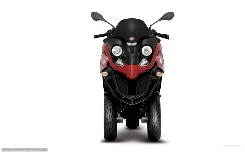 front view of red and black three-wheeled scooter