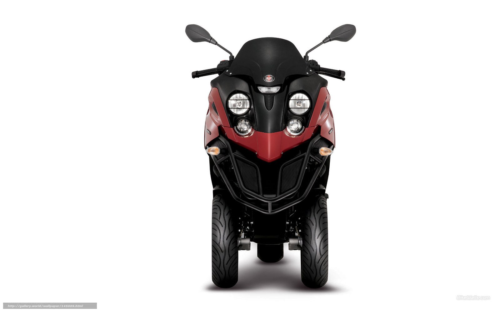 front view of red and black three-wheeled scooter