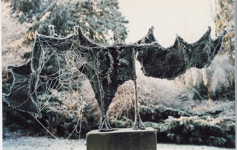 Frost-covered bat sculpture