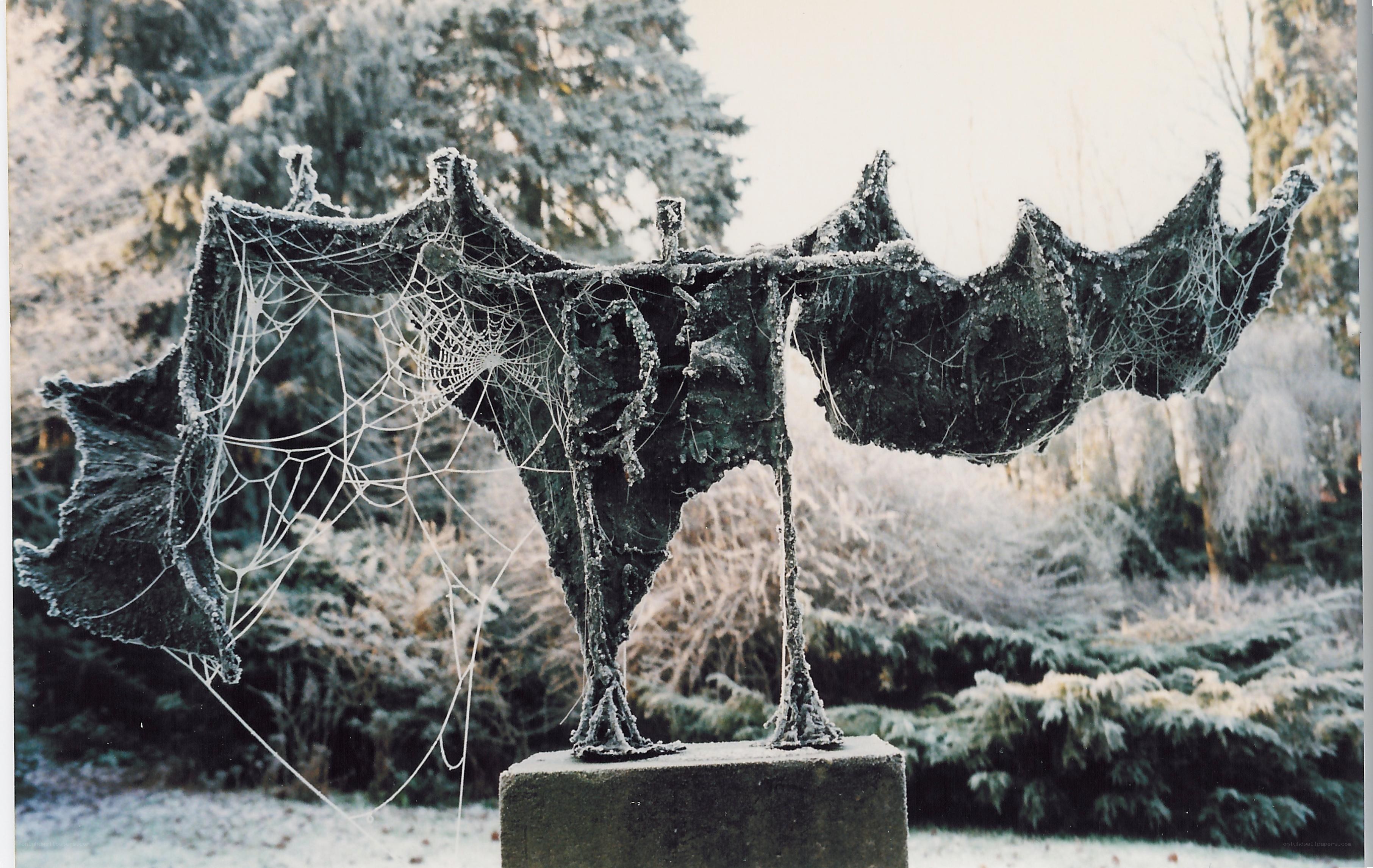 Frost-covered bat sculpture