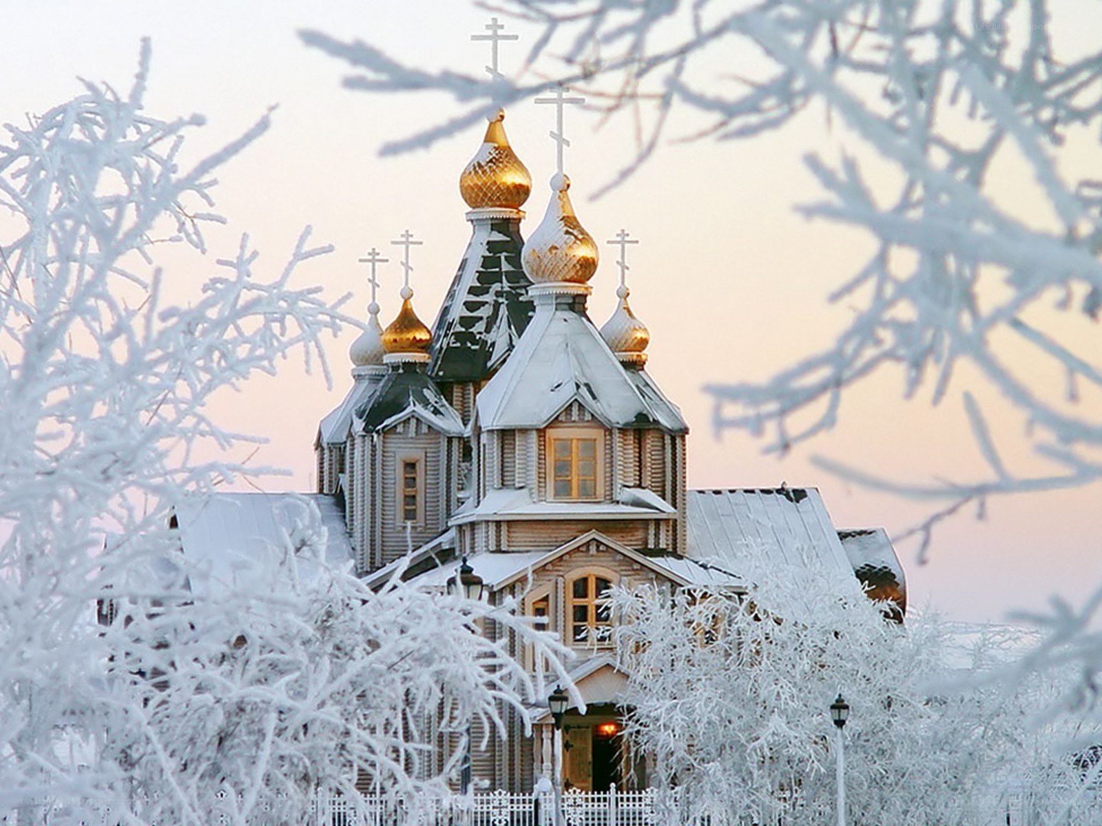 Frost-covered church at dawn