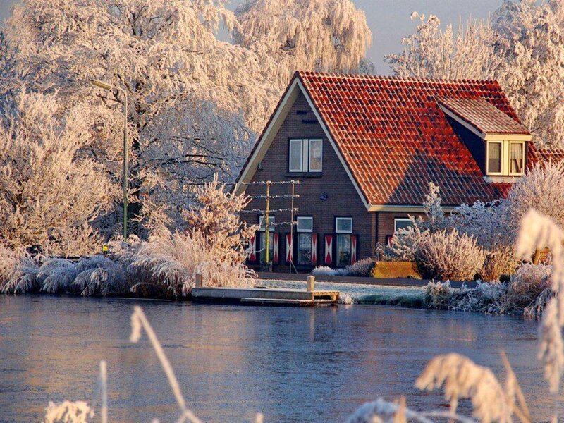 Frost-covered House by Canal