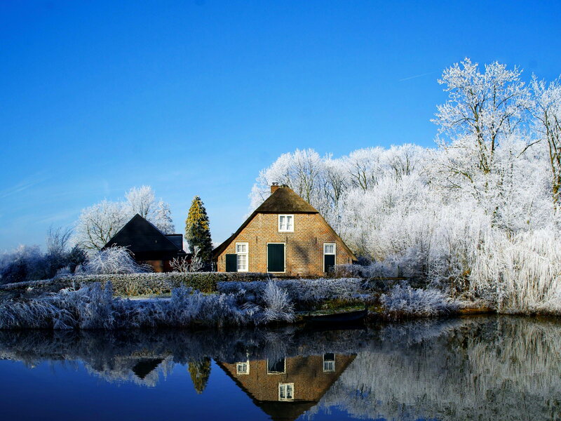 Frost-covered House by River — Blue