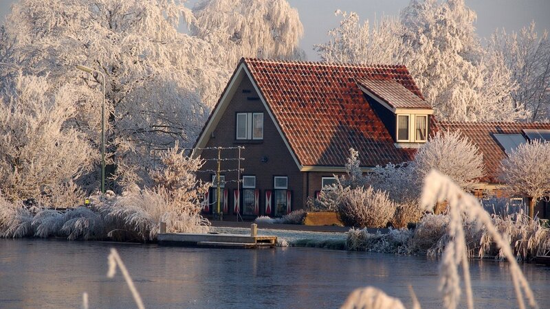 Frost-covered House by Water — Brown