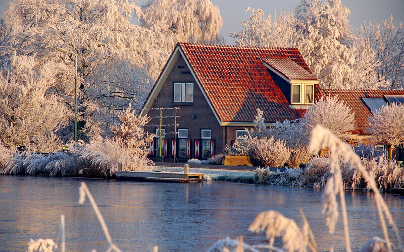 Frost-covered House by Water — Red