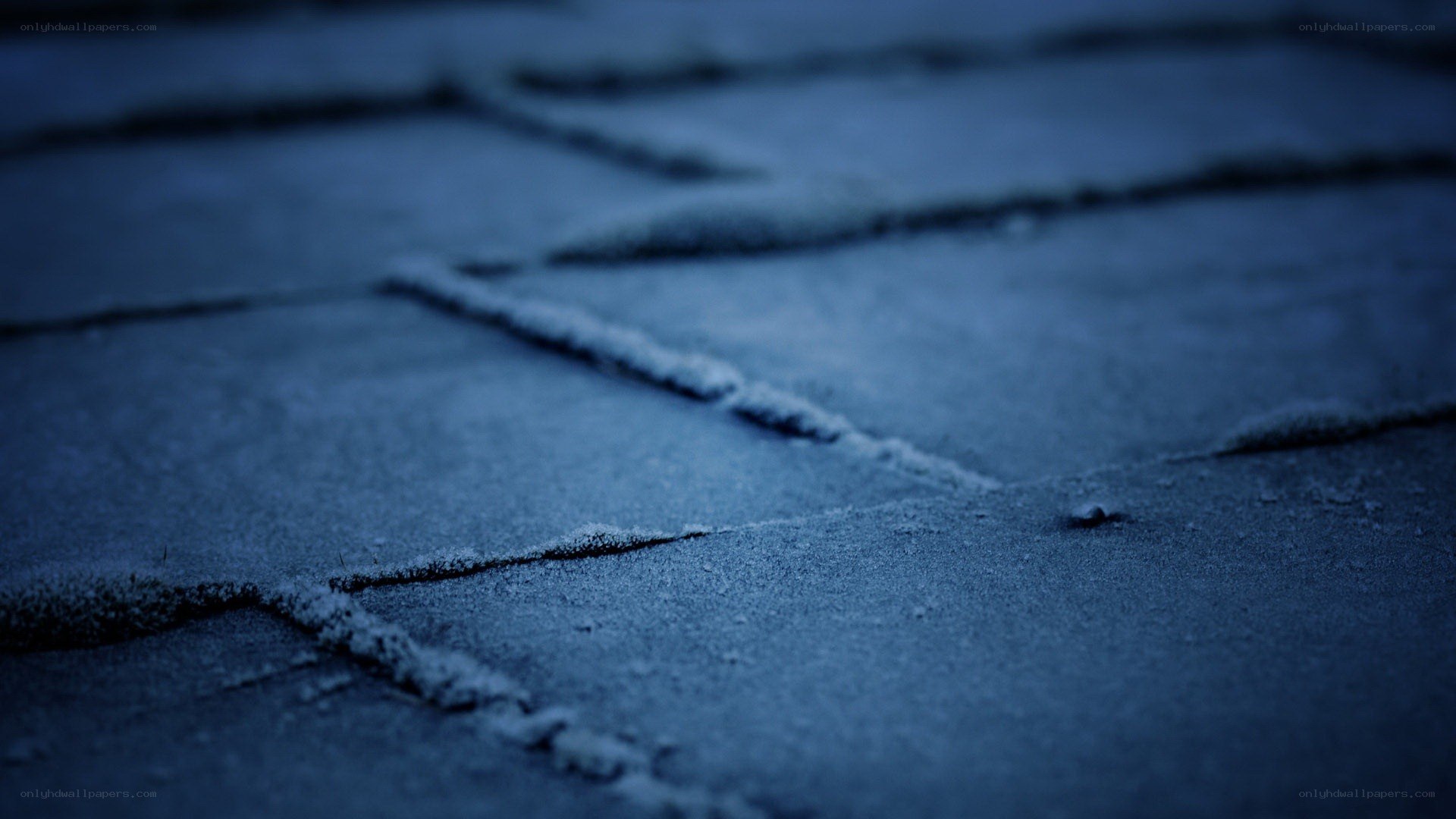 frost-covered pavement at night