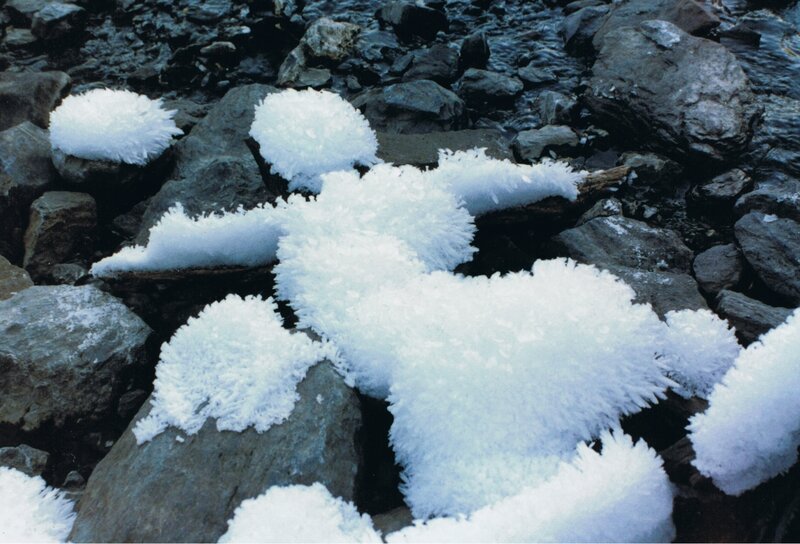 frost-covered rocks in stream