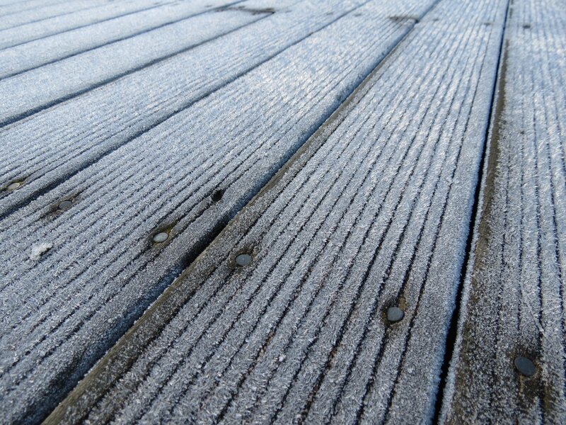 frost-covered wooden deck