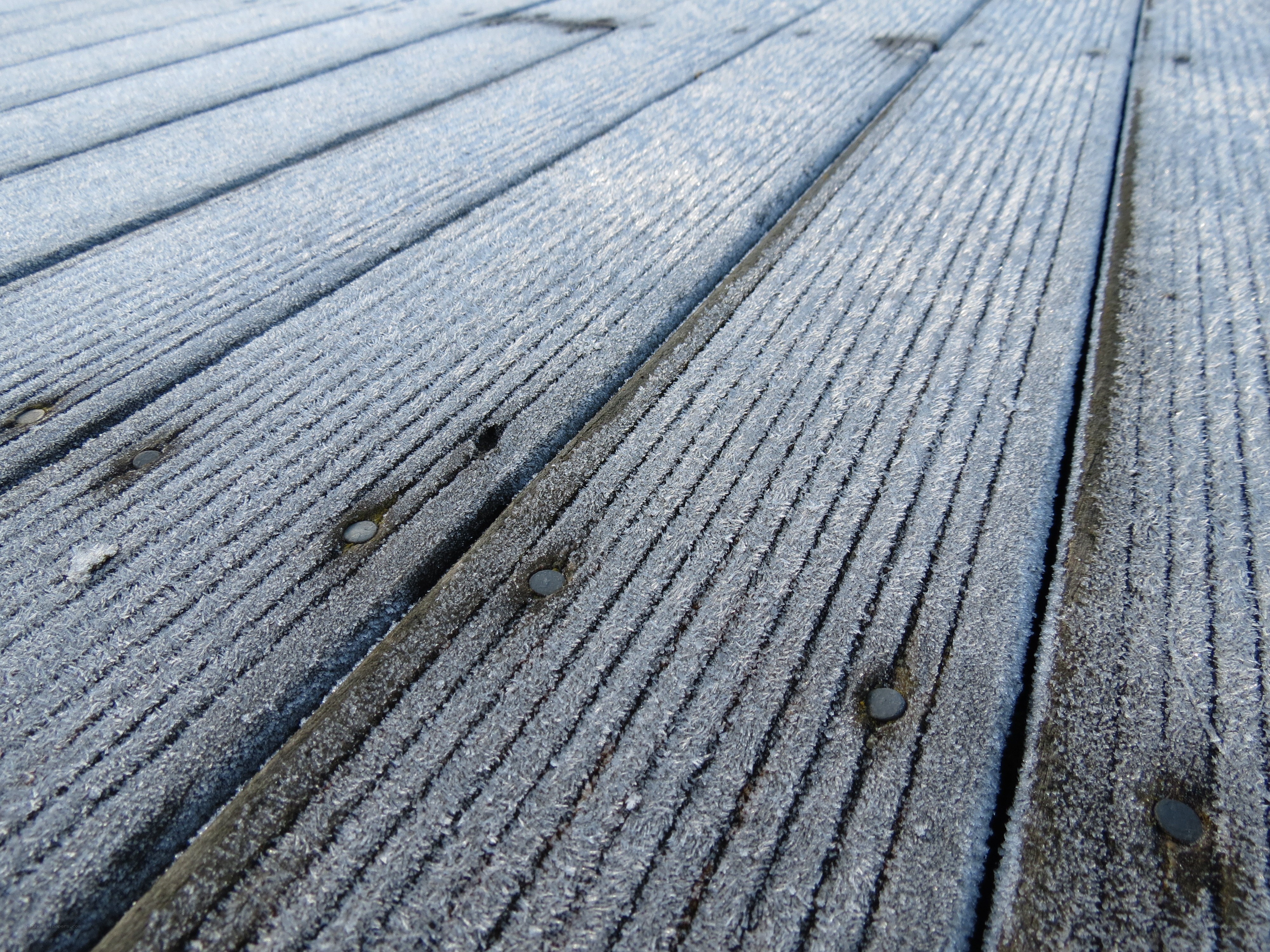 frost-covered wooden deck
