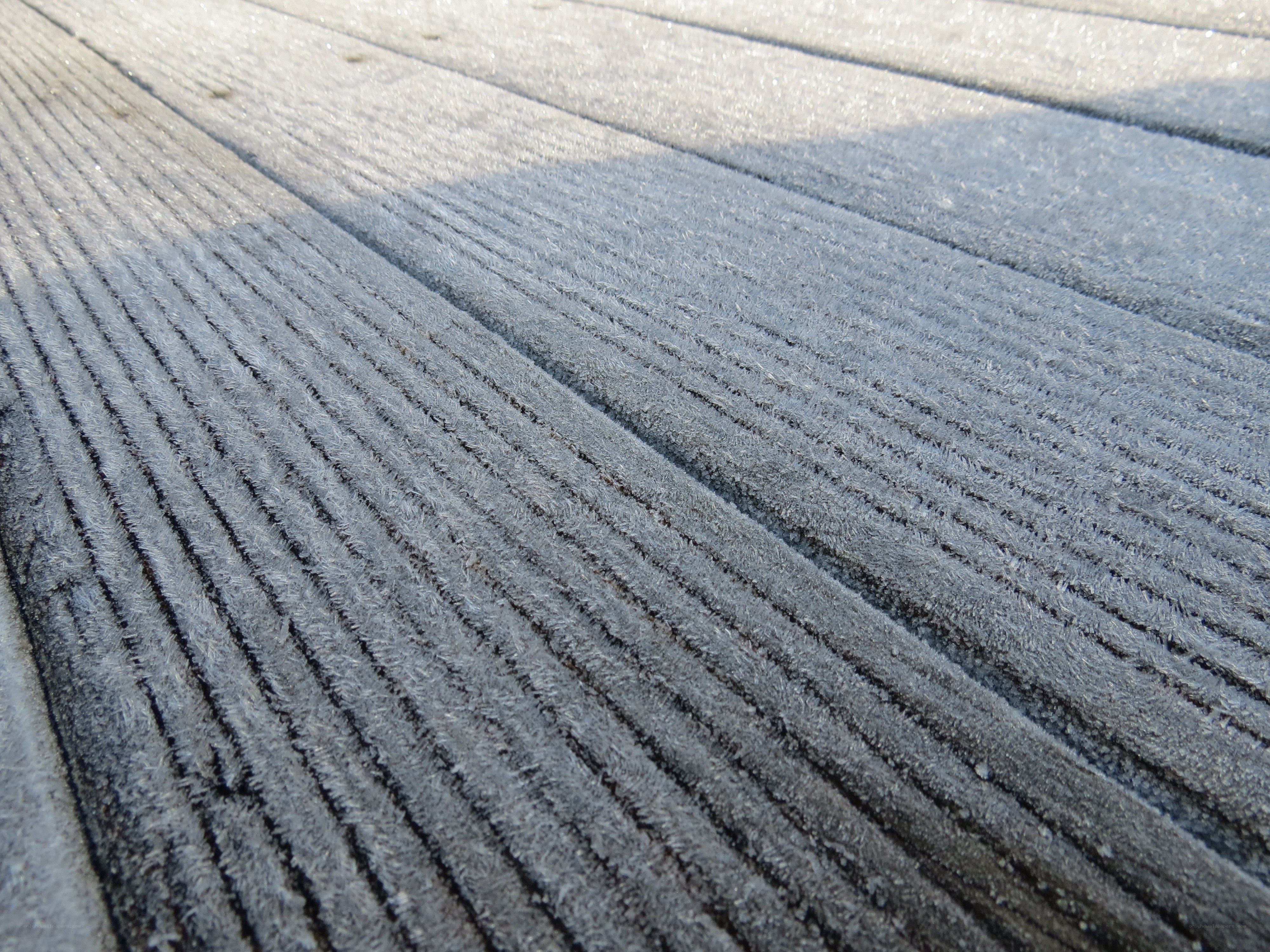 frost-covered wooden surface