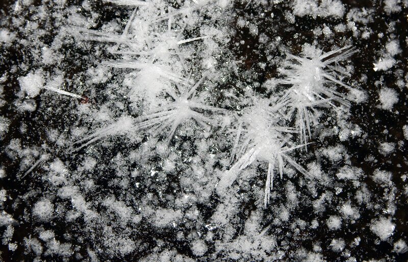 frost crystals on dark surface