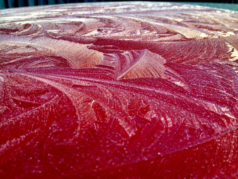 frost patterns on red surface