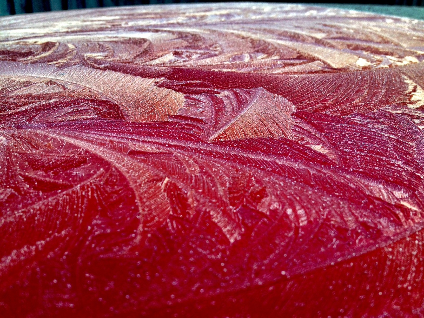 frost patterns on red surface
